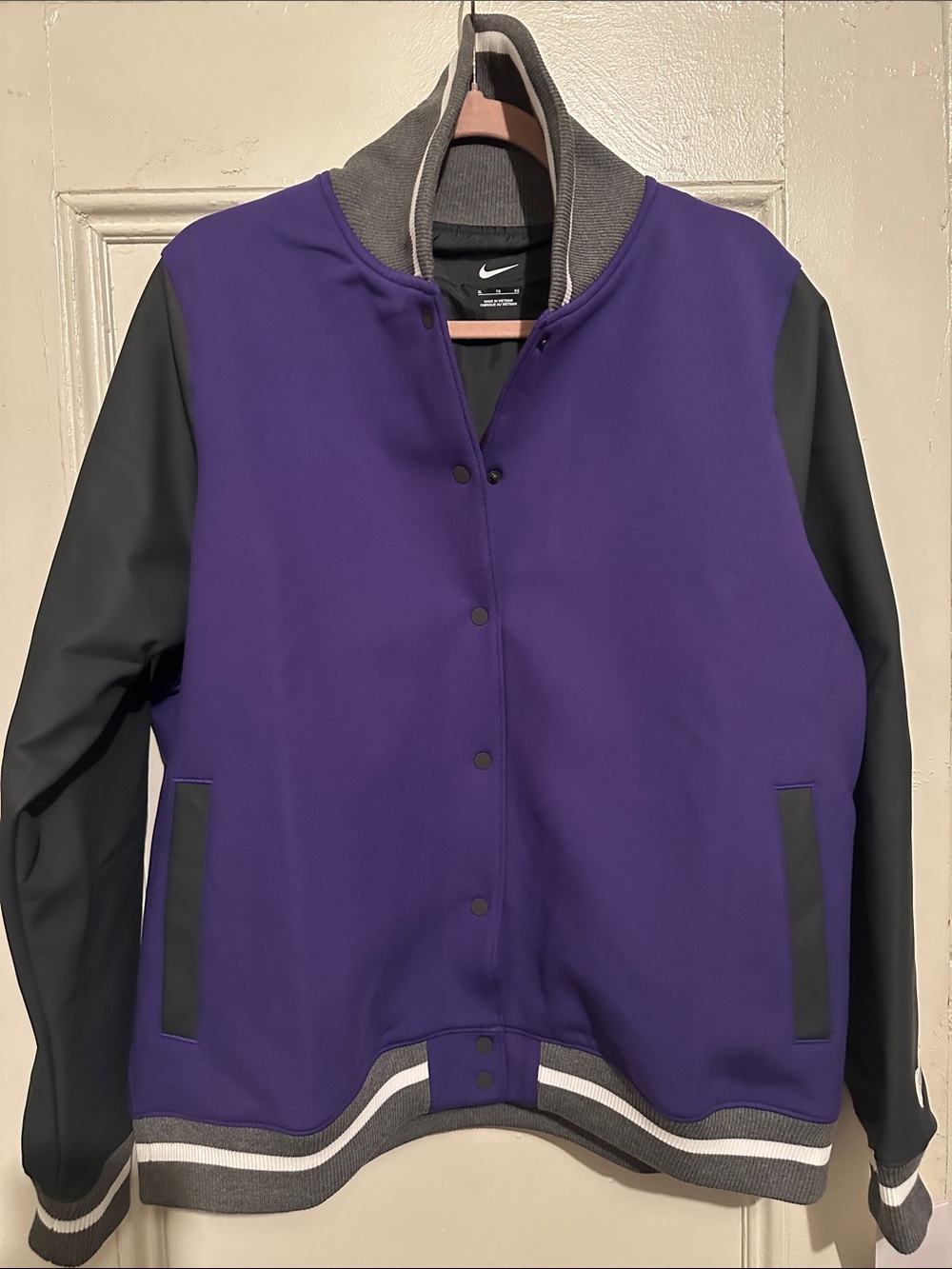 NWT Nike Women's Purple and Black Varsity Jacket. 31”L x 23.5”W. Size XL.